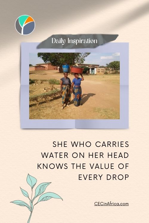 African Women carrying buckets