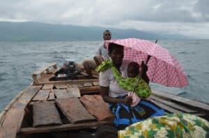 African woman with a baby on a boat