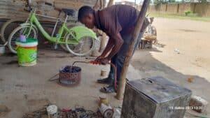 Preparing brazier for cooking lunch