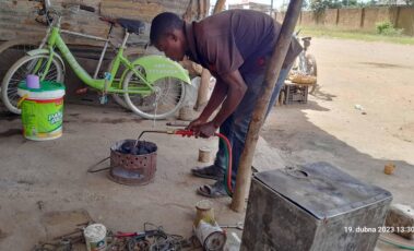 Preparing brazier for cooking lunch