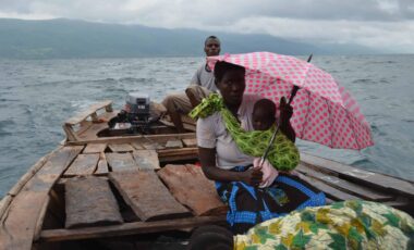 African woman with a baby on a boat